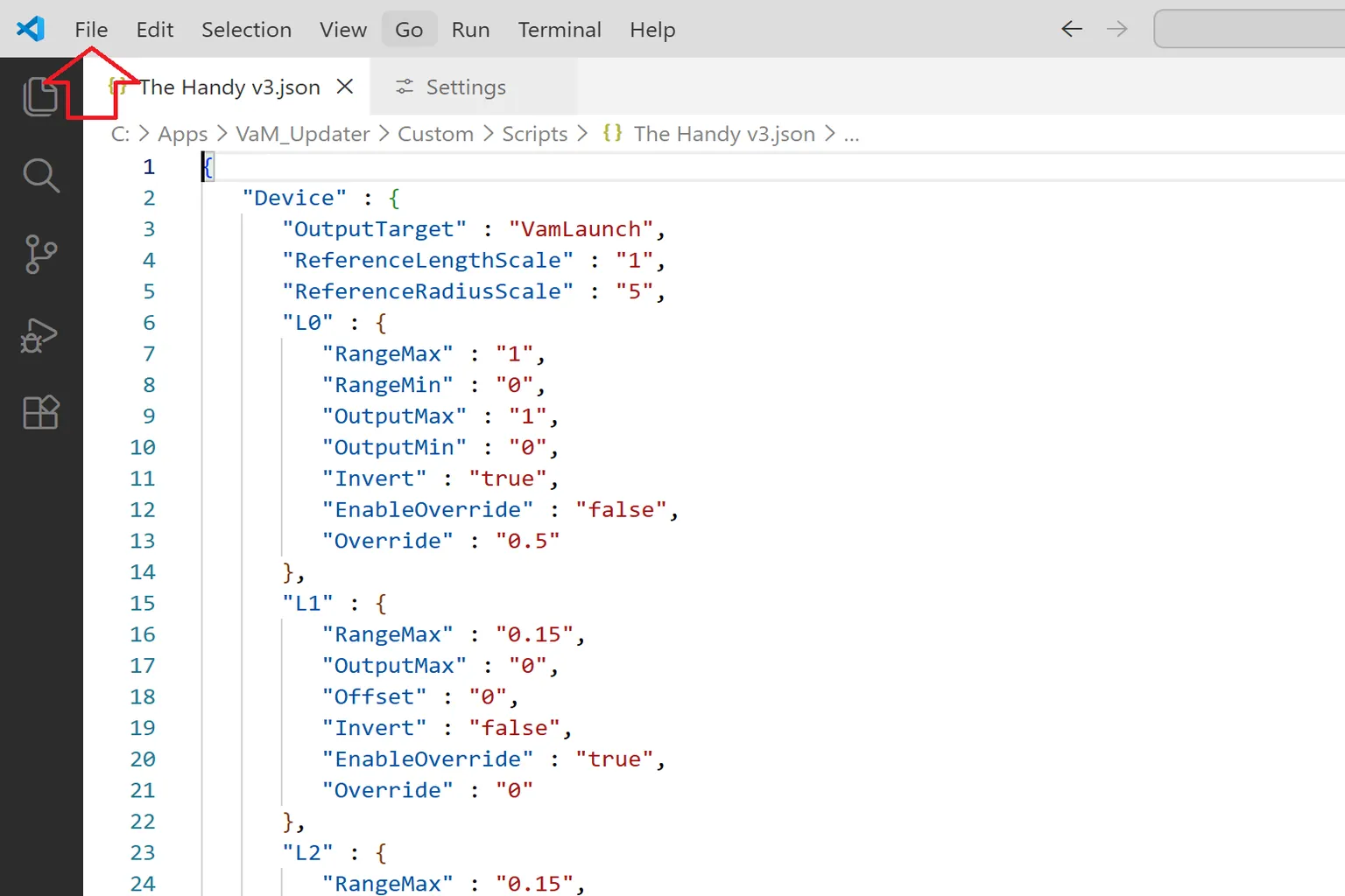Fichier de configuration The Handy v3 ouvert dans Visual Studio Code avec une flèche vers le menu File.