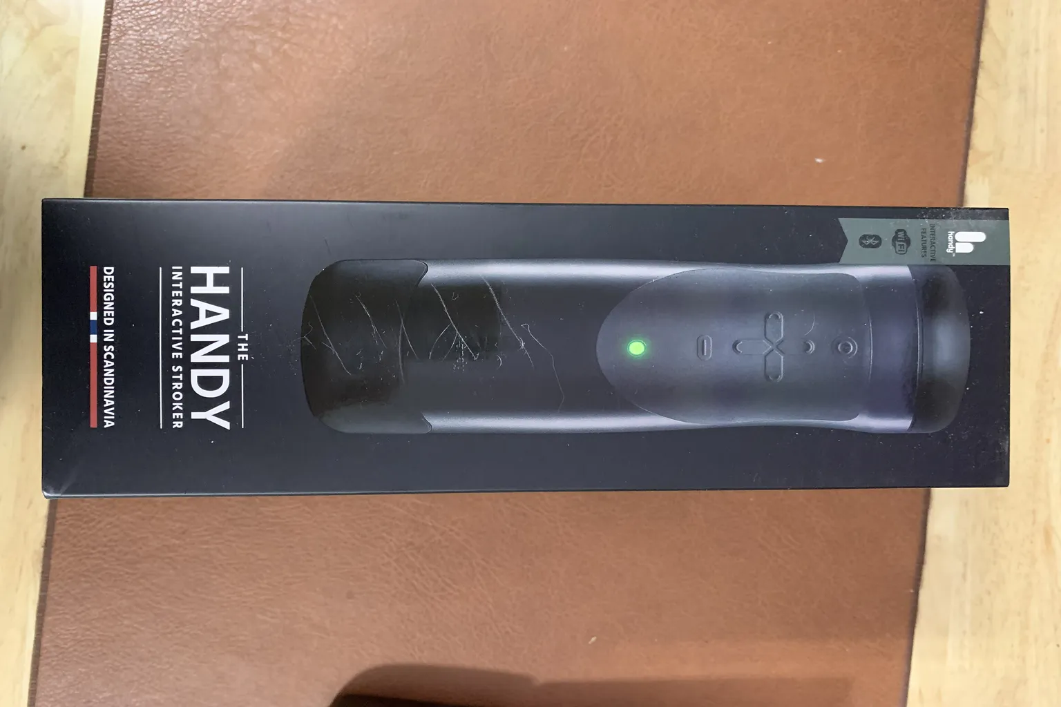 The front of The Handy’s outer box, showing the product design and branding clearly.