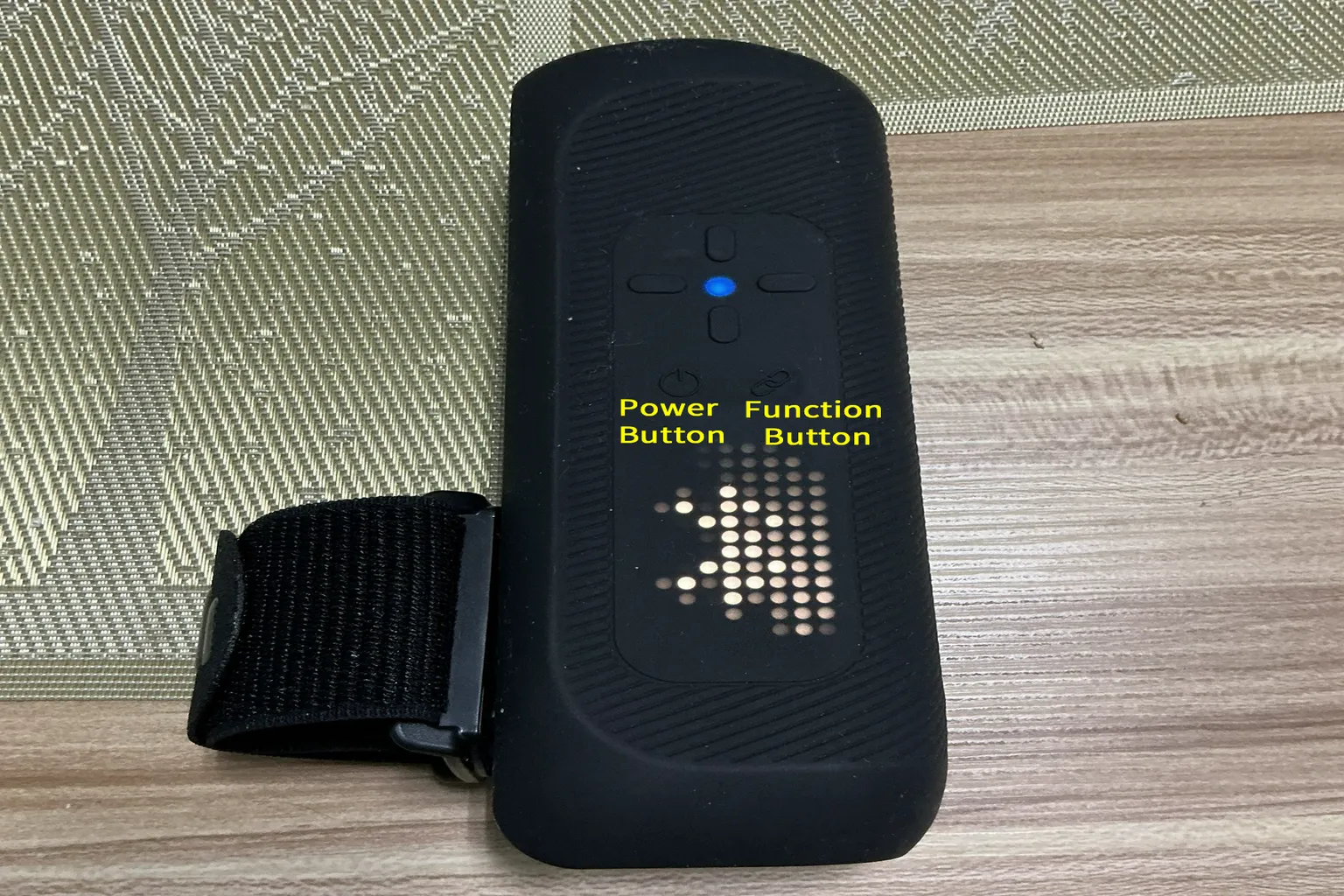 The Handy 2 Pro powered on with a blue indicator light, showing the device ready for Bluetooth pairing.