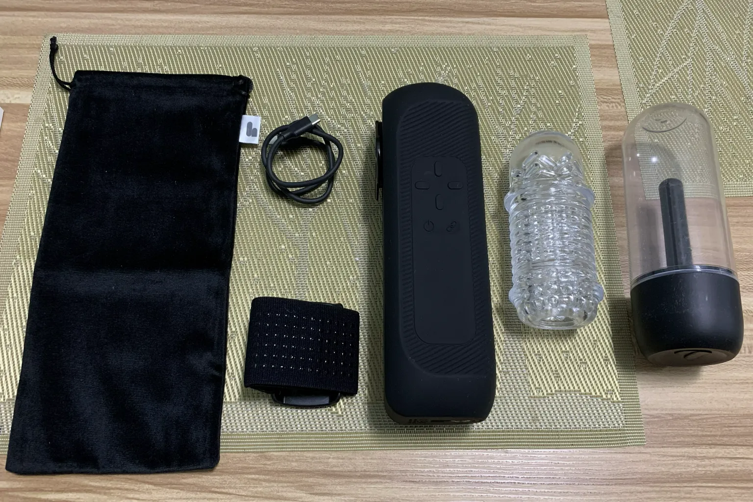 Full The Handy 2 Pro package contents laid out on a table, including the main device, TrueGrip sleeve, dryer case, USB-C cable, Velcro strap, and carrying pouch.