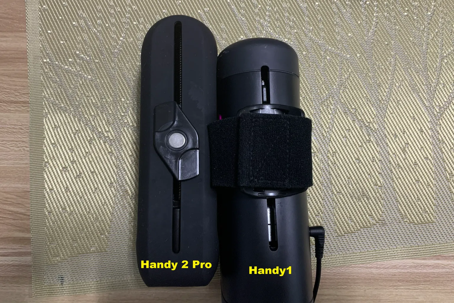 Slider track comparison between The Handy 2 Pro and original Handy with both grip attachments installed.